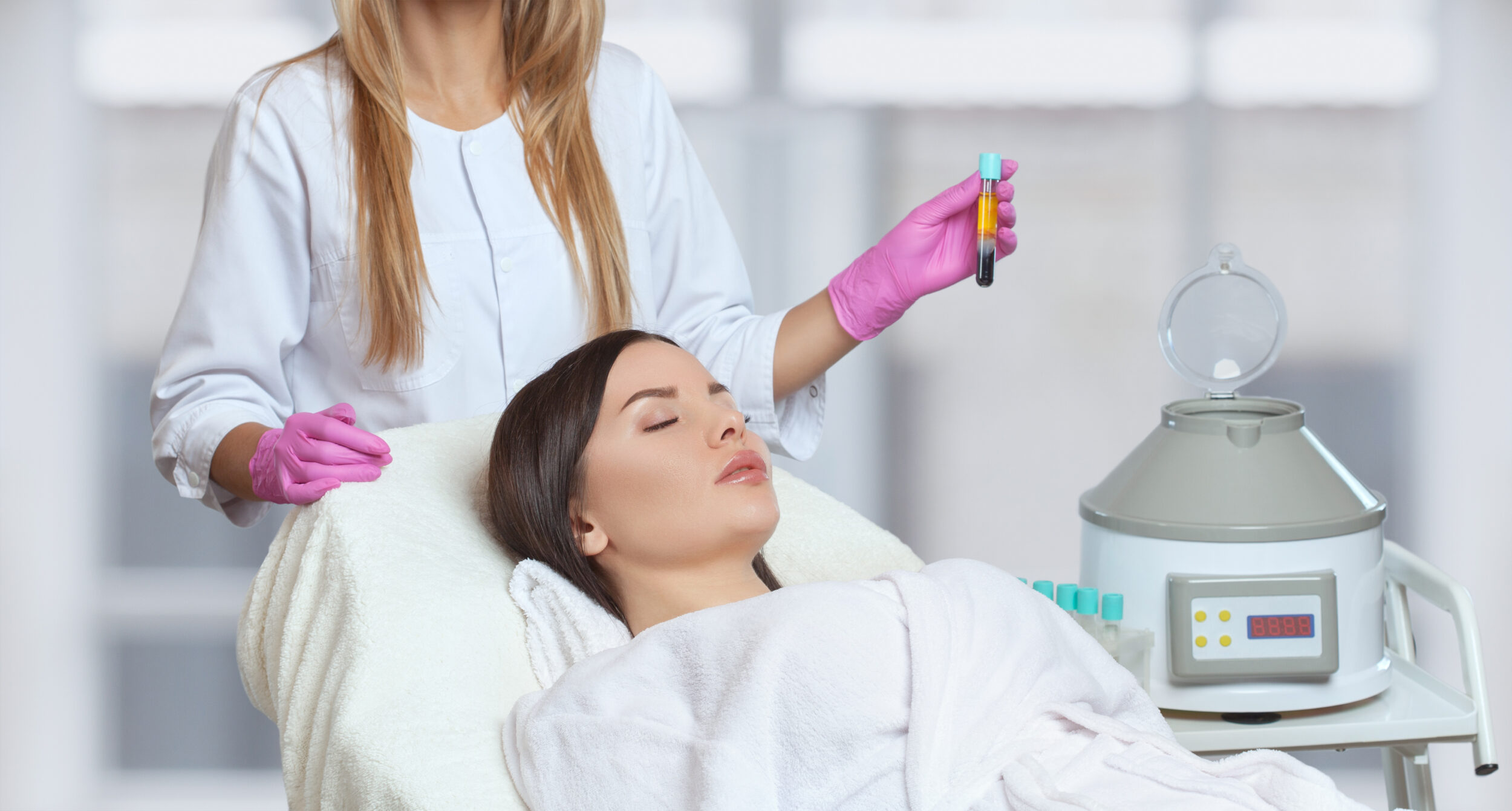Woman reclines, eyes closed, as her PRF specialist administers treatment